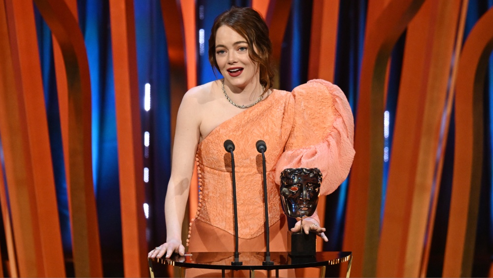 LONDON, ENGLAND - FEBRUARY 18: Emma Stone accepts the Leading Actress Award for