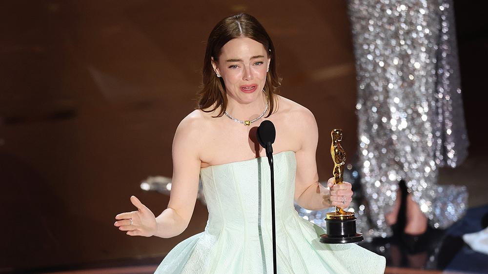 Emma Stone accepts the Lead Actress award for